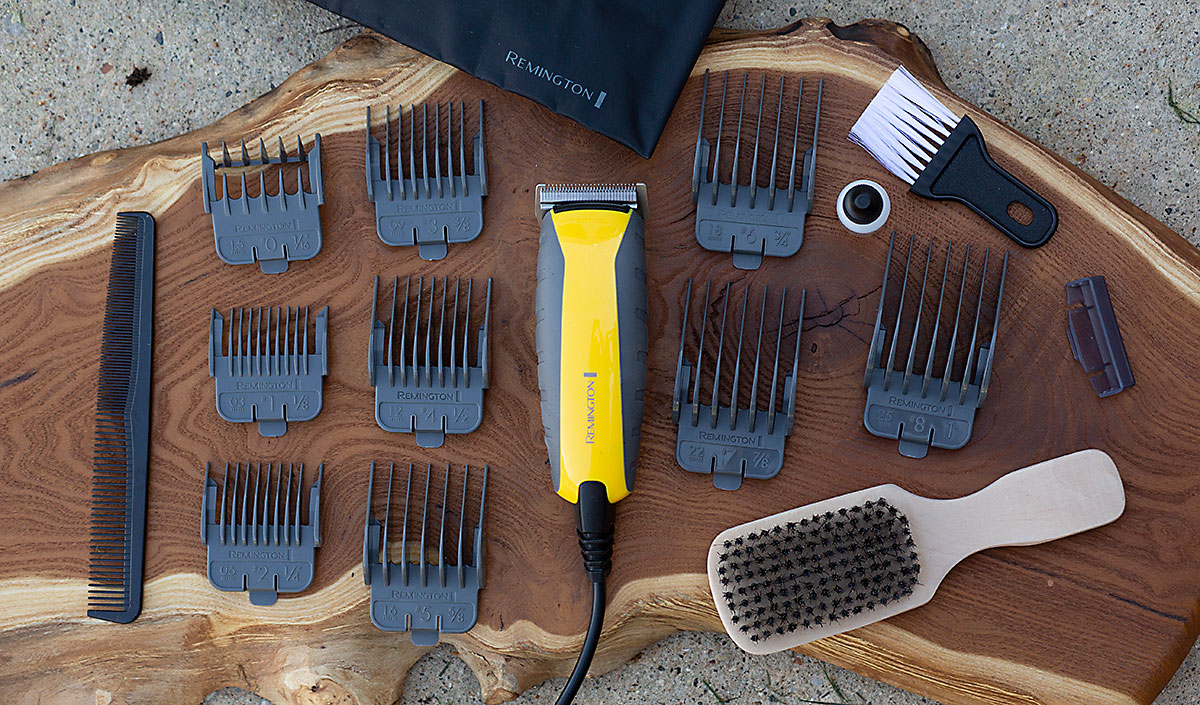 Cortadora de cabello indestructible a prueba de impactos sobre madera rodeada de 9 peines y 5 accesorios